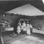 historic photo of of children in a room
