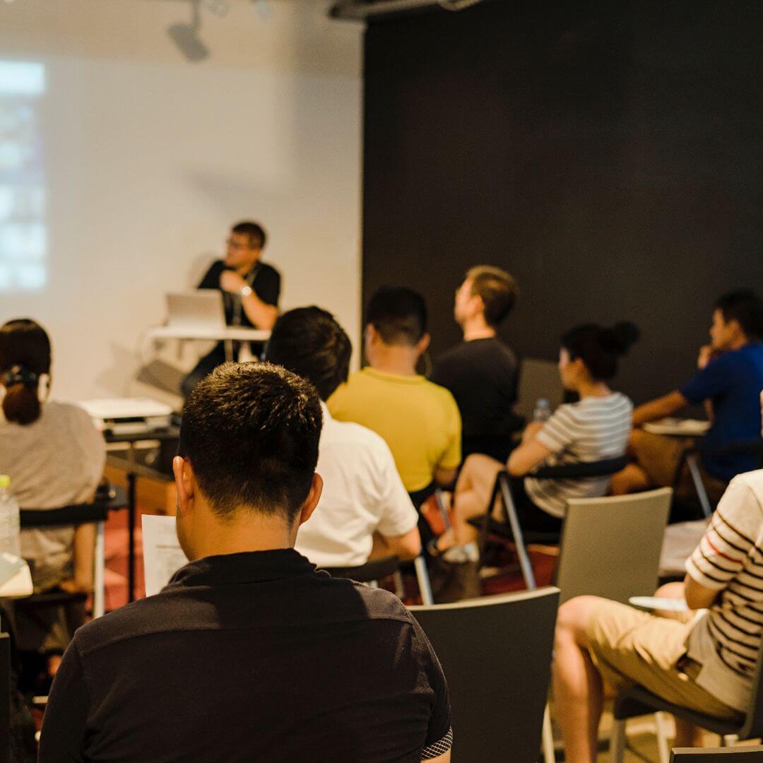 Classroom full of students learning from an instructor