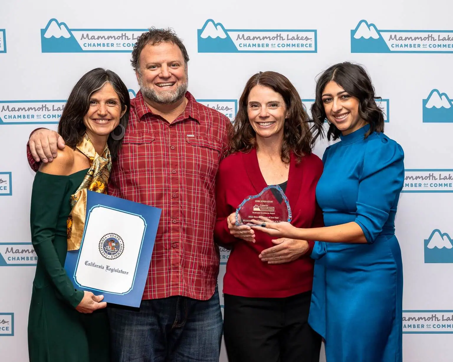 Mammoth Pizza Co. and Slice Bar pose with Chamber staff Brianna Goico and their award for New Business of the Year