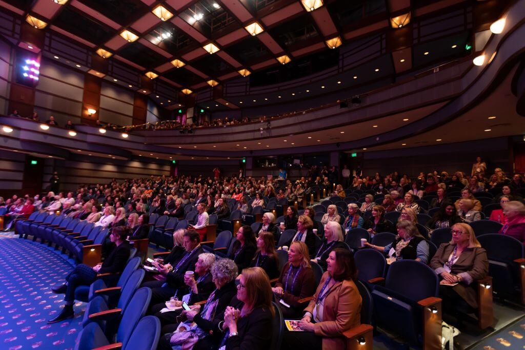 Seated theater audience at the East Bay Women's Conference 2023