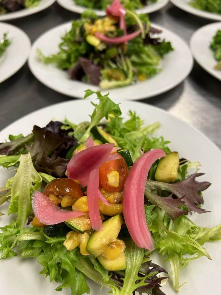 Mixed greens topped with grilled corn, zucchini, and cherry tomato salsa with pickled red onions finished with housemade vinaigrette using Olive Oil Co. Jalapeno &amp; Lime Balsamic with Cilantro &amp; Onion Olive Oil
Sponsored by: Olive Oil Co. Barrie Newmarket Midland