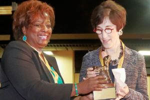 Dr. Marilyn Armour receiving an award