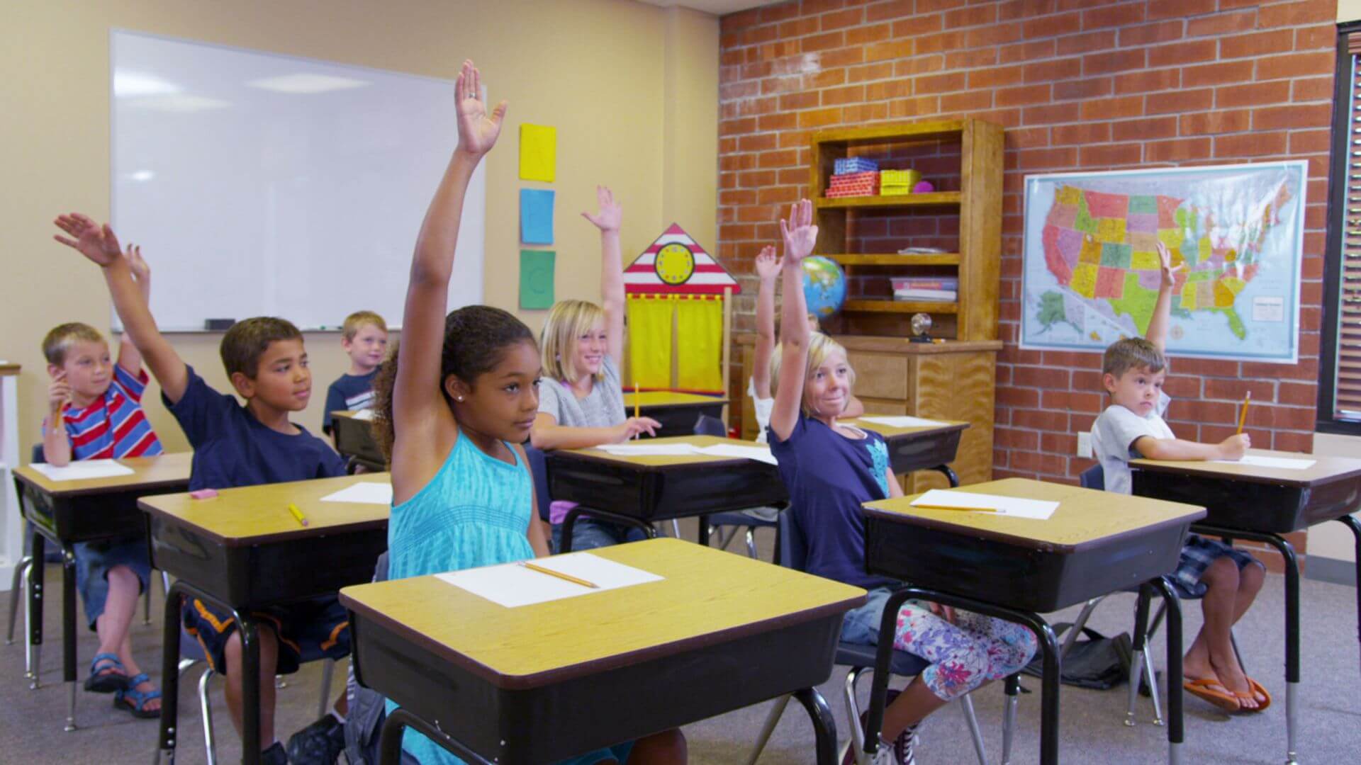 Photo classroom raised hands