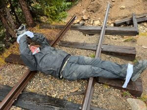 man on railroad tracks