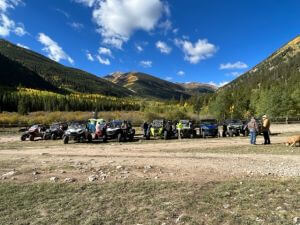atvs with mountains in the background