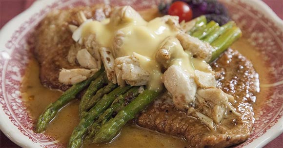 plate of veal francaise with asparagus