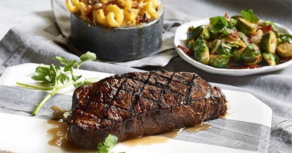 steak dinner with mac n cheese and brussel sprouts