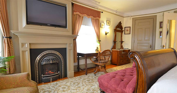 charming bed & breakfast bedroom with gas fireplace