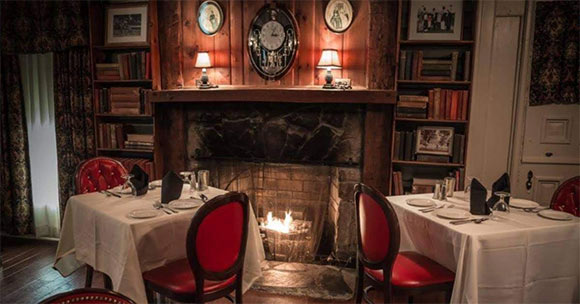 intimate restaurant setting with fireplace