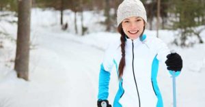 Young woman x-country skiing