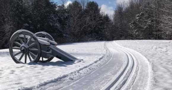 Saratoga National Park cannon on snowy trail