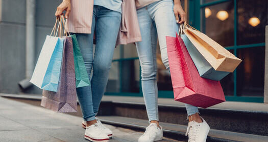 women holding shopping bags
