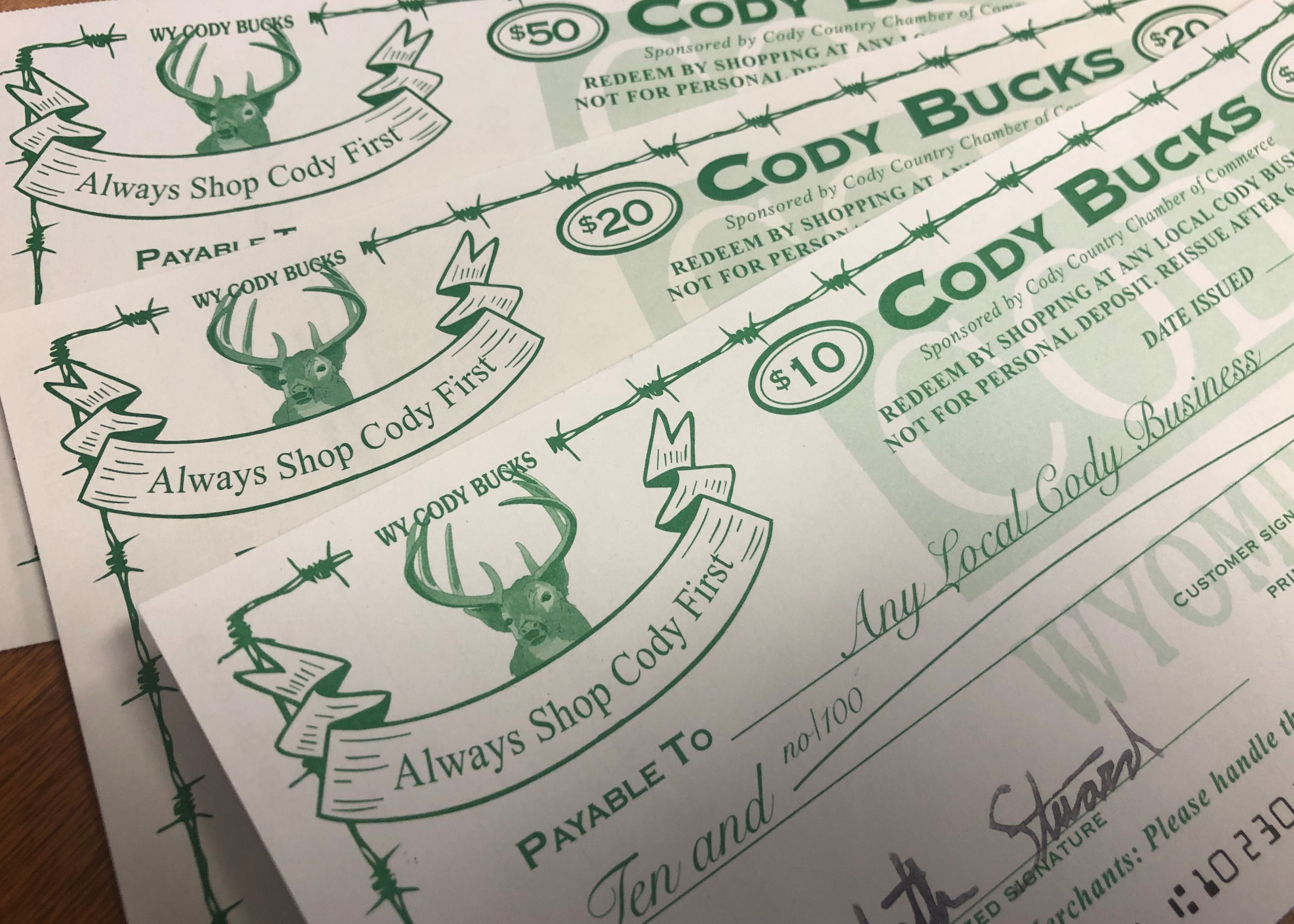 A photograph of several Cody Bucks certificates