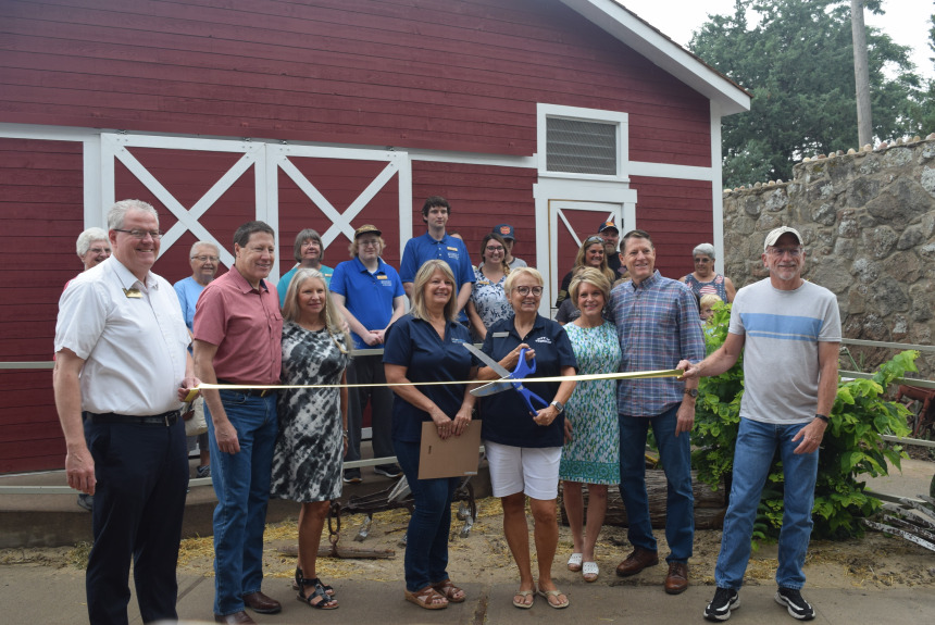 Overland Trail Museum staff members, Propst family members, Logan County Historical Society and Logan County Chamber of Commerce members and guests gather for a ribbon cutting ceremony to celebrate the opening of the museum's new Propst Agriculture Center For Kids Saturday, July 31, 2021.