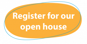 A orange yellow oval button with the words 'register for our open house' written in white text on it.