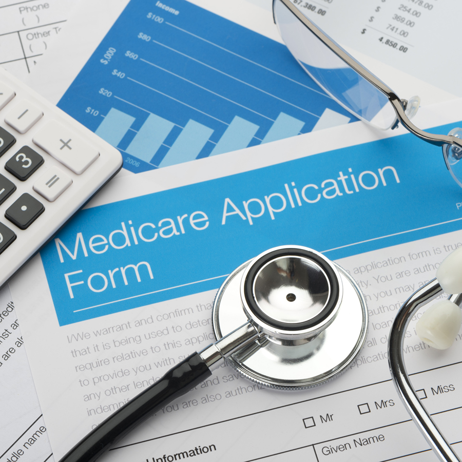 Medicare application form with stethoscope and paperwork