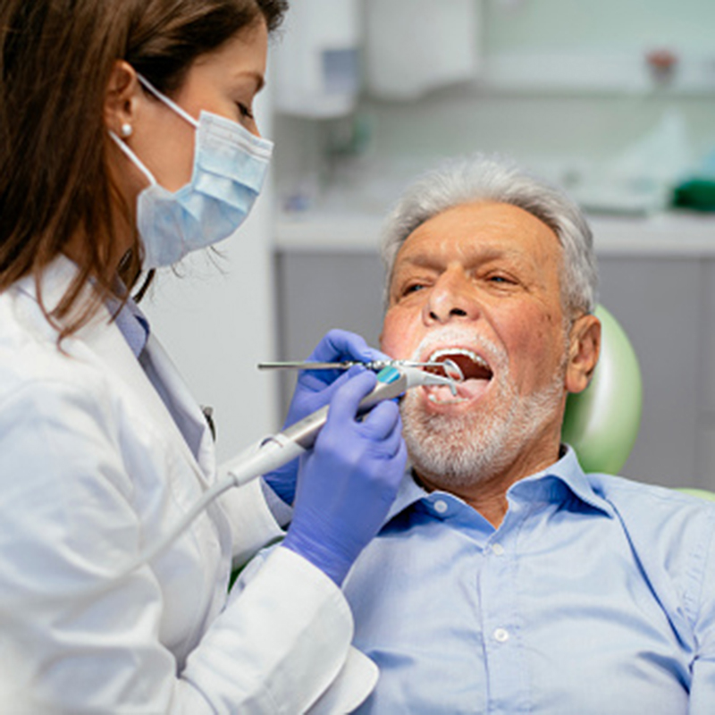 Senior man at the dentist. Shadow DOF. Developed from RAW; retouched with special care and attention; Small amount of grain added for best final impression. 16 bit Adobe RGB color profile.