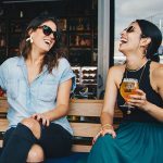two women having cocktails at brewery