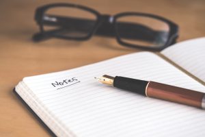 Pen lying on open notebook