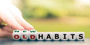 hand-turns-dice-and-changes-the-expression-old-habits-to-new-habits