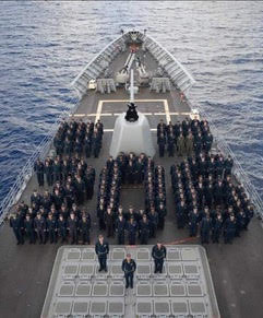 Crew of USS San Jacinto form “206” to represent the number of days they were at sea.