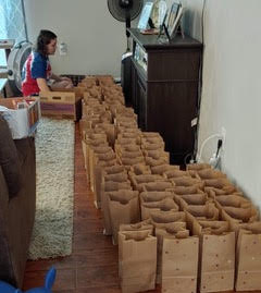 Assembling gift bags for sailors on the USS San Jacinto