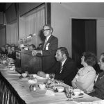 Derek J. de Solla Price (at podium), on his right (l to r) Melvin Weinstock, Mary Herner, Herbert Koller