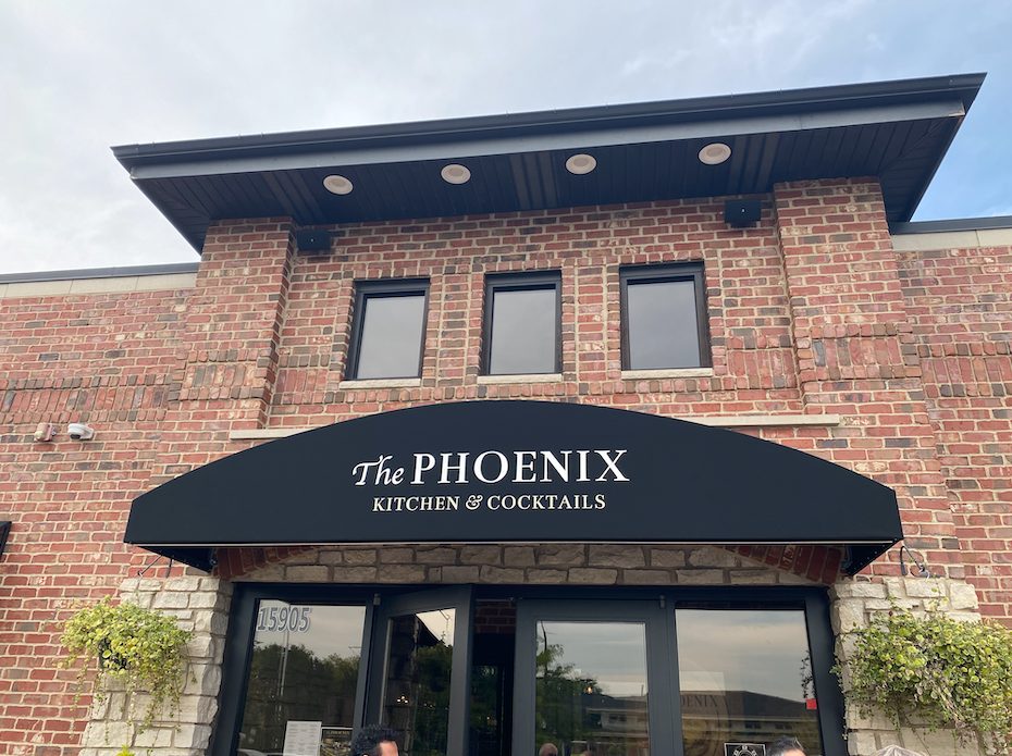 The Front of The Phoenix (brick exterior and awning)