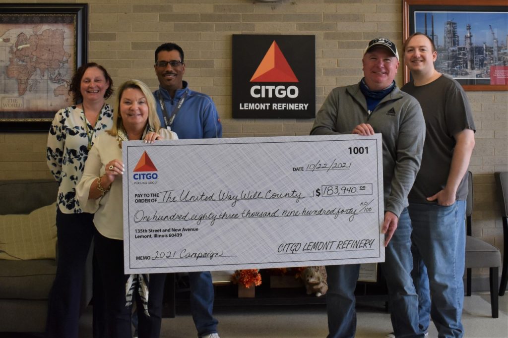 Citgo workers holding a giant check for United Way Will County